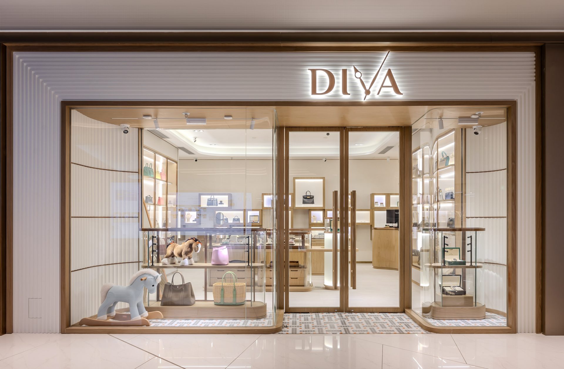 Diva Watch & Jewellery — storefront with a glazed entrance and illuminated brand signage