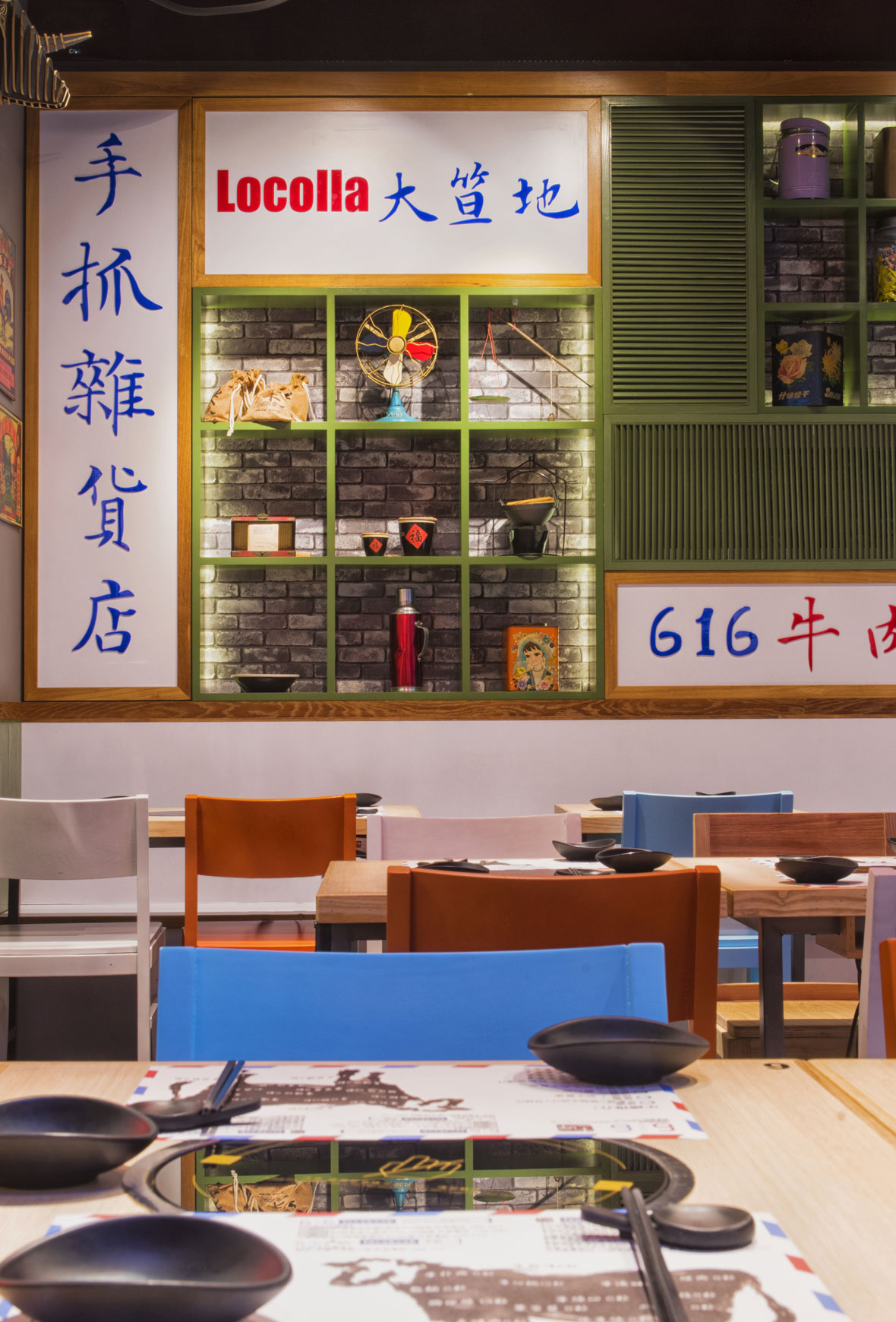 616 Beef Hotpot | Red neon cow motif on a white tiled wall