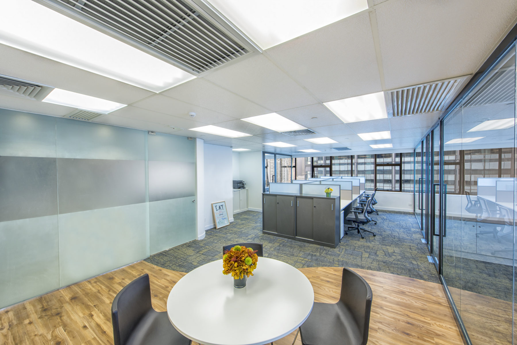 Wah Luen (Hong Kong) Office ｜ Meeting room with a long wooden table and large windows