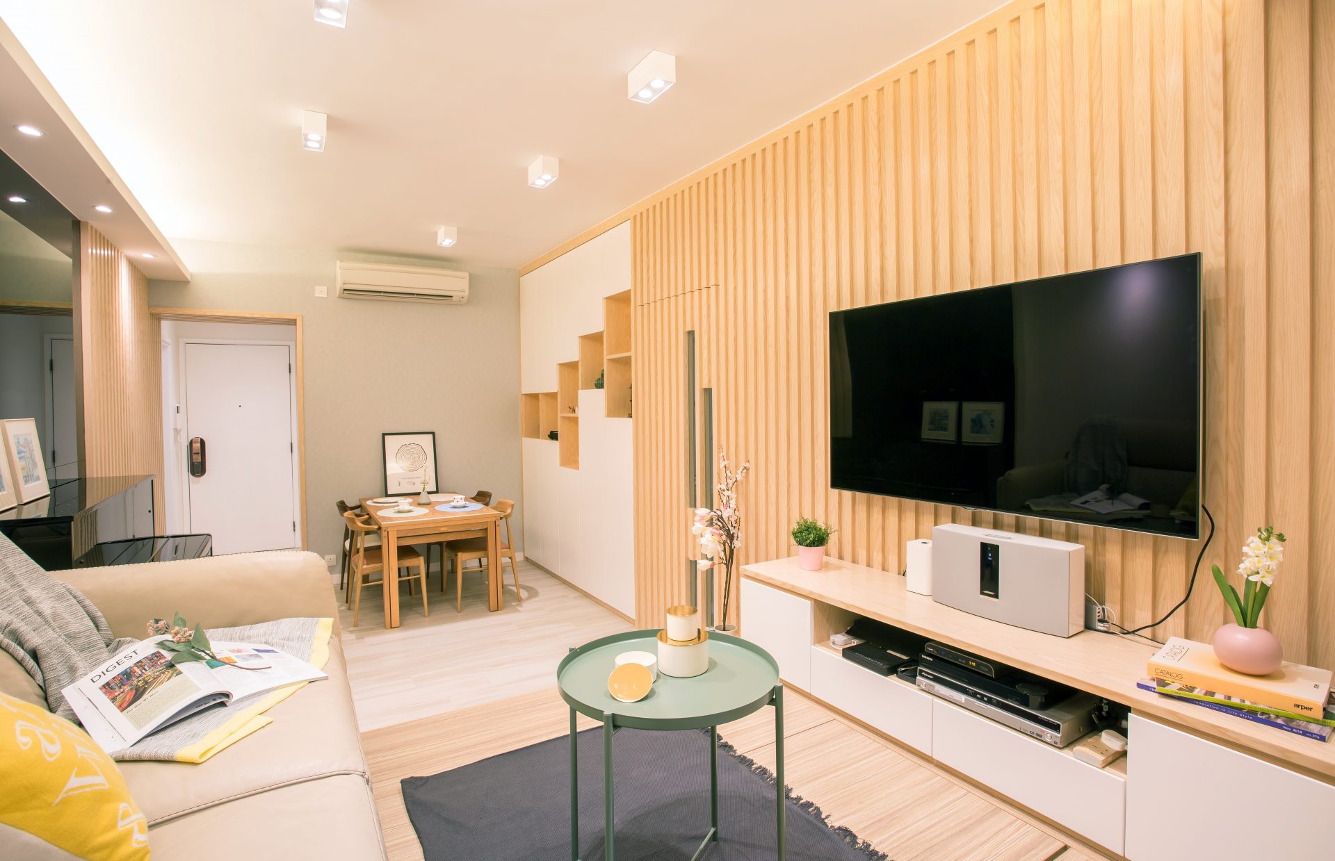 Living room feature wall of timber slats and TV cabinet