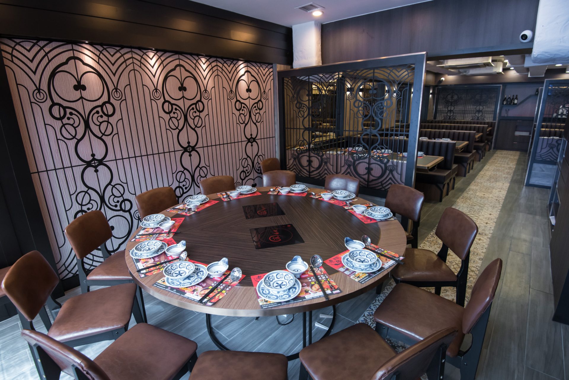 Gundek Zhan Hot Pot | Private round-table room with a TV screen